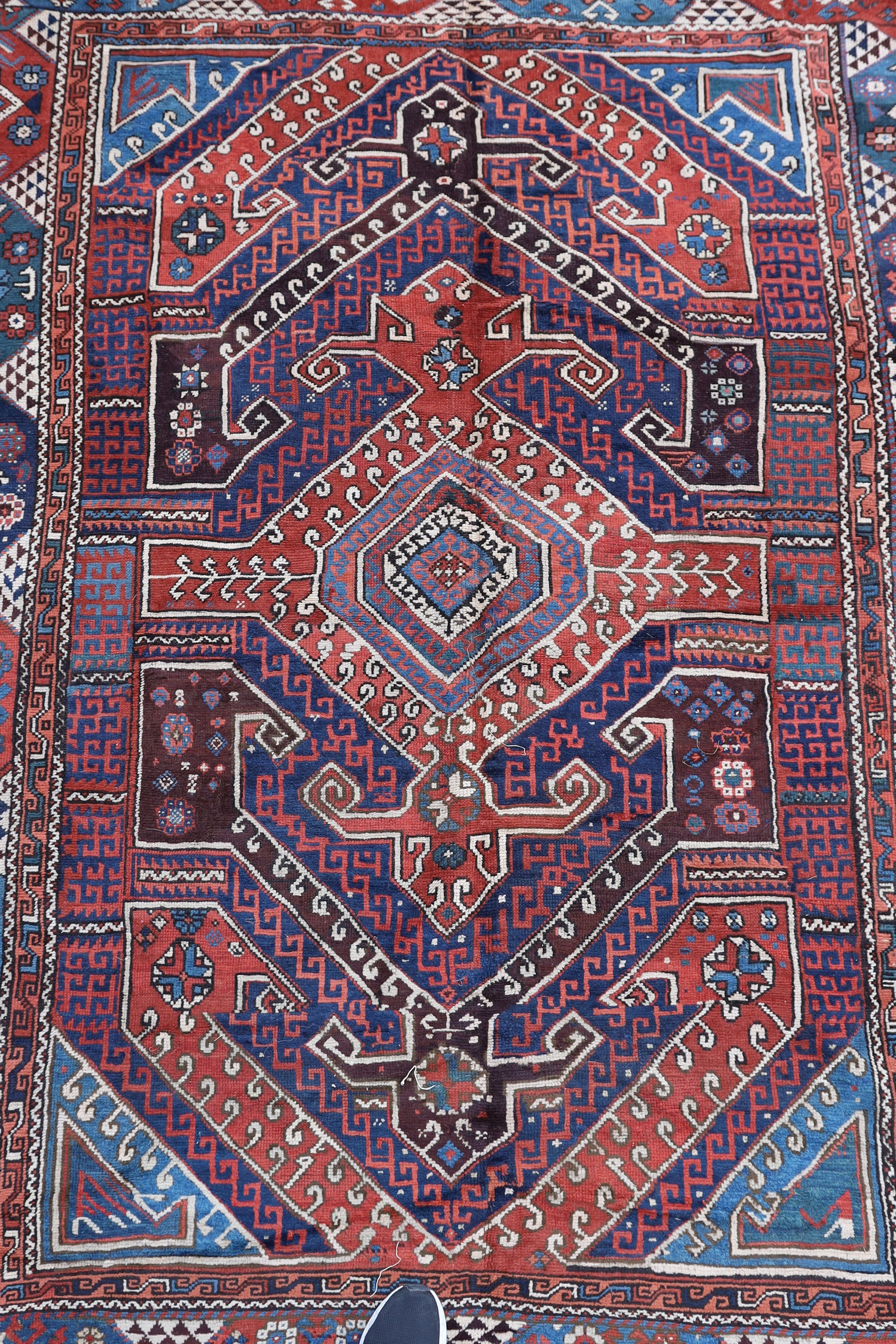 A Bergam Turkish blue ground rug 254 x 198cm
